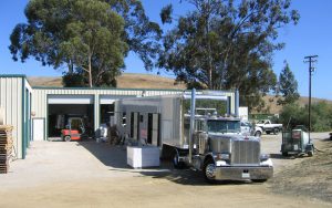 A large mobile bottling line truck